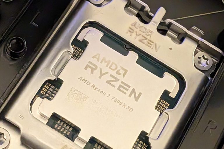 Close-up of an AMD Ryzen processor mounted on a motherboard socket.