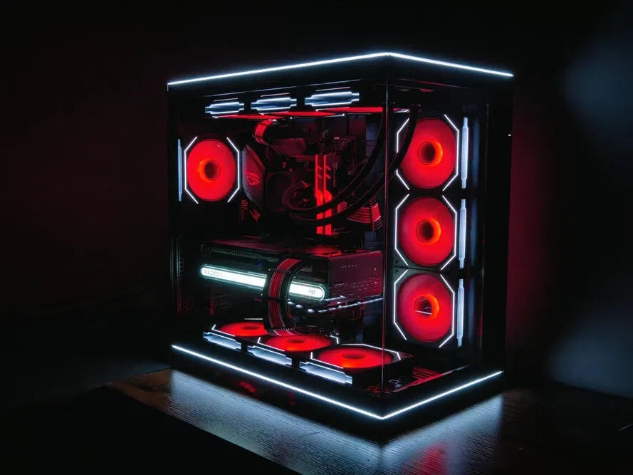 A high-performance gaming PC with red LED lighting and a modern design.